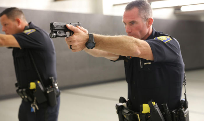 Two NH Police Officers aiming their SIG SAUER P320 service pistols