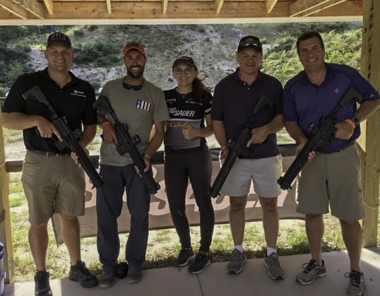 Team SIG shooter Lena Miculek and the Pine Tree Council Boy Scouts at the Maine Shooting Sports Experience
