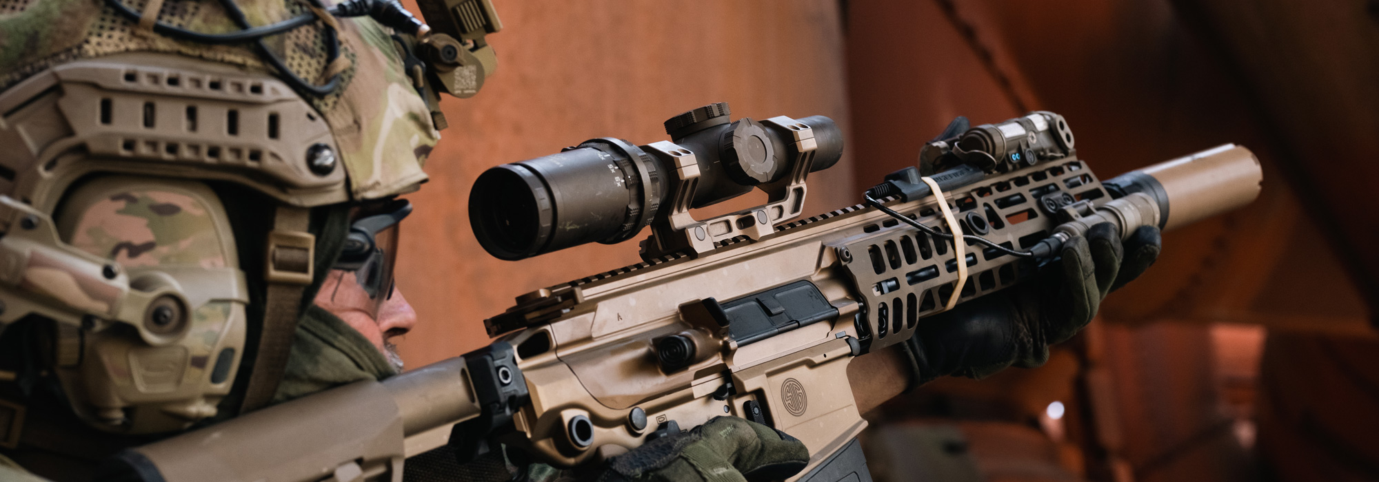 A SIG optics user sighting his rifle with SIG SAUER weapon scopes & sights.