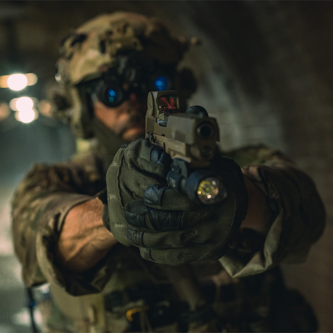 Optical sight mounted on a weapon to enhance shooter accuracy.