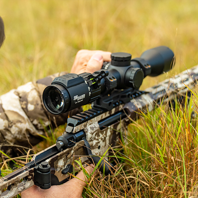 Weapon scopes & sights mounted on a rifle. 