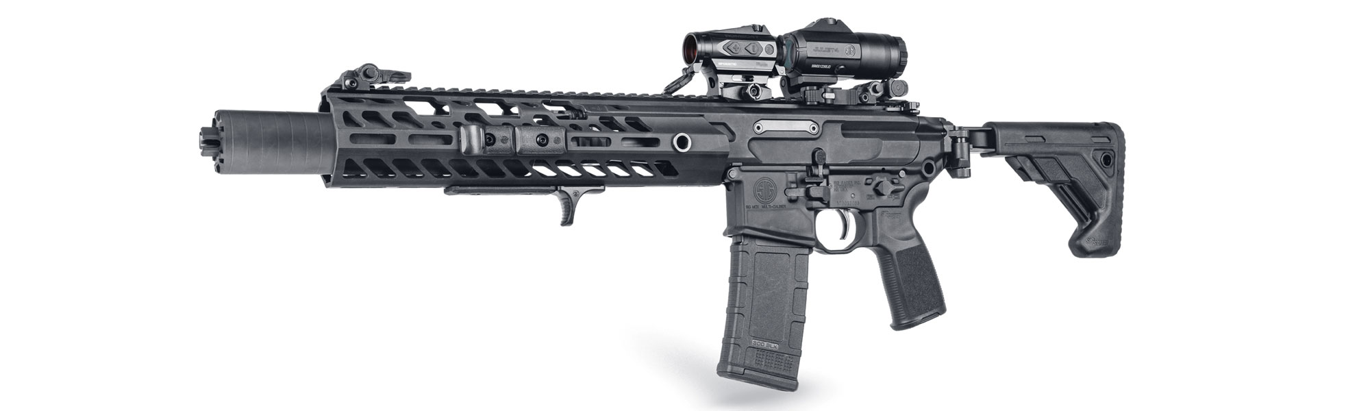 The SIG MCX is shown with magnifies and closed red dot optic. 
