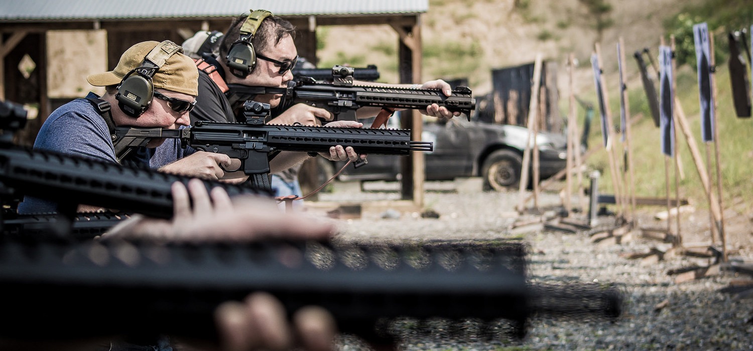 SIG SAUER Academy students shooting at the range targets. 